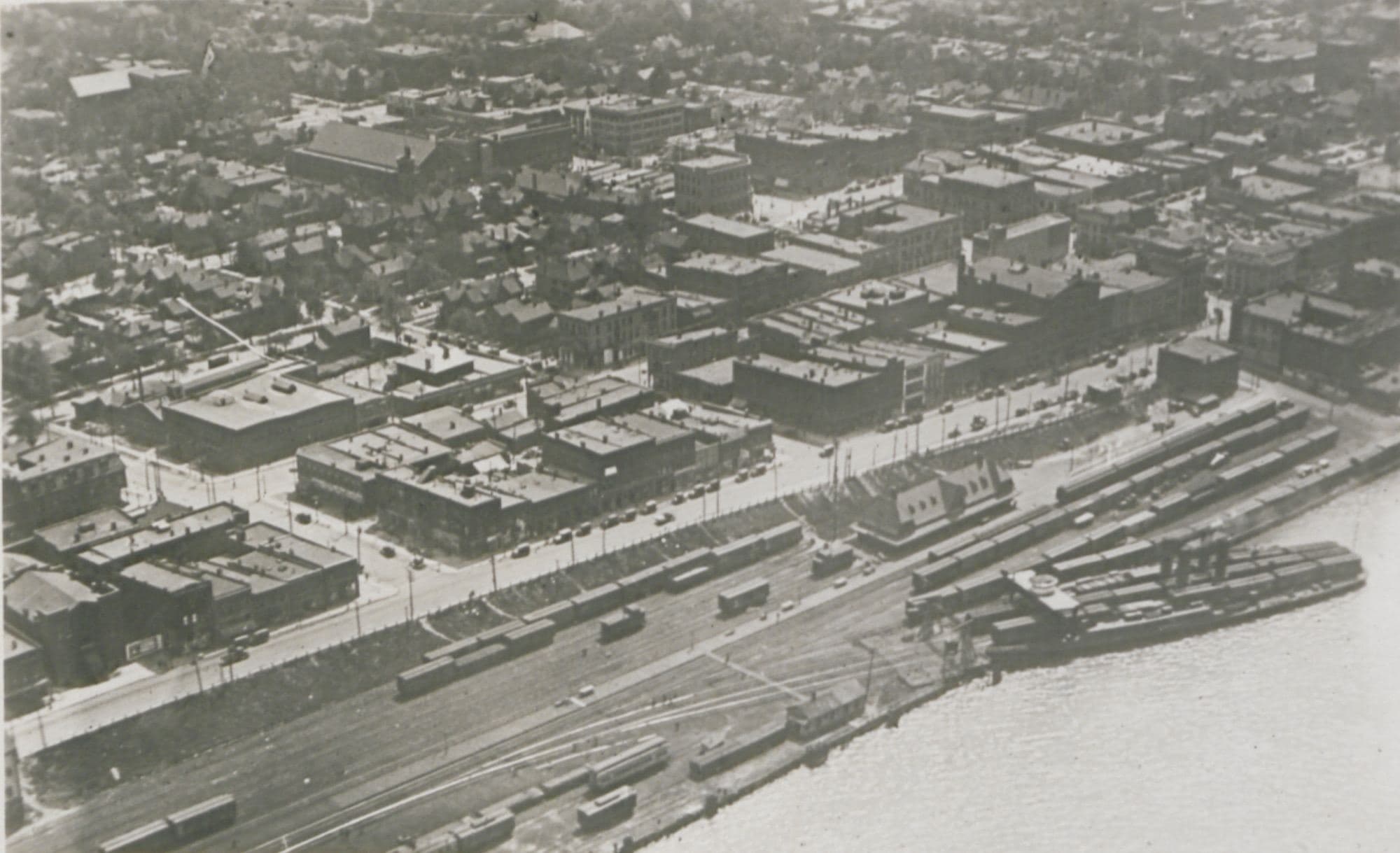 Windsor, Ontario, from the air in 1920: the river, the rail yards and the downtown blocks, in the year the town chartered the first Lions club outside the United States.